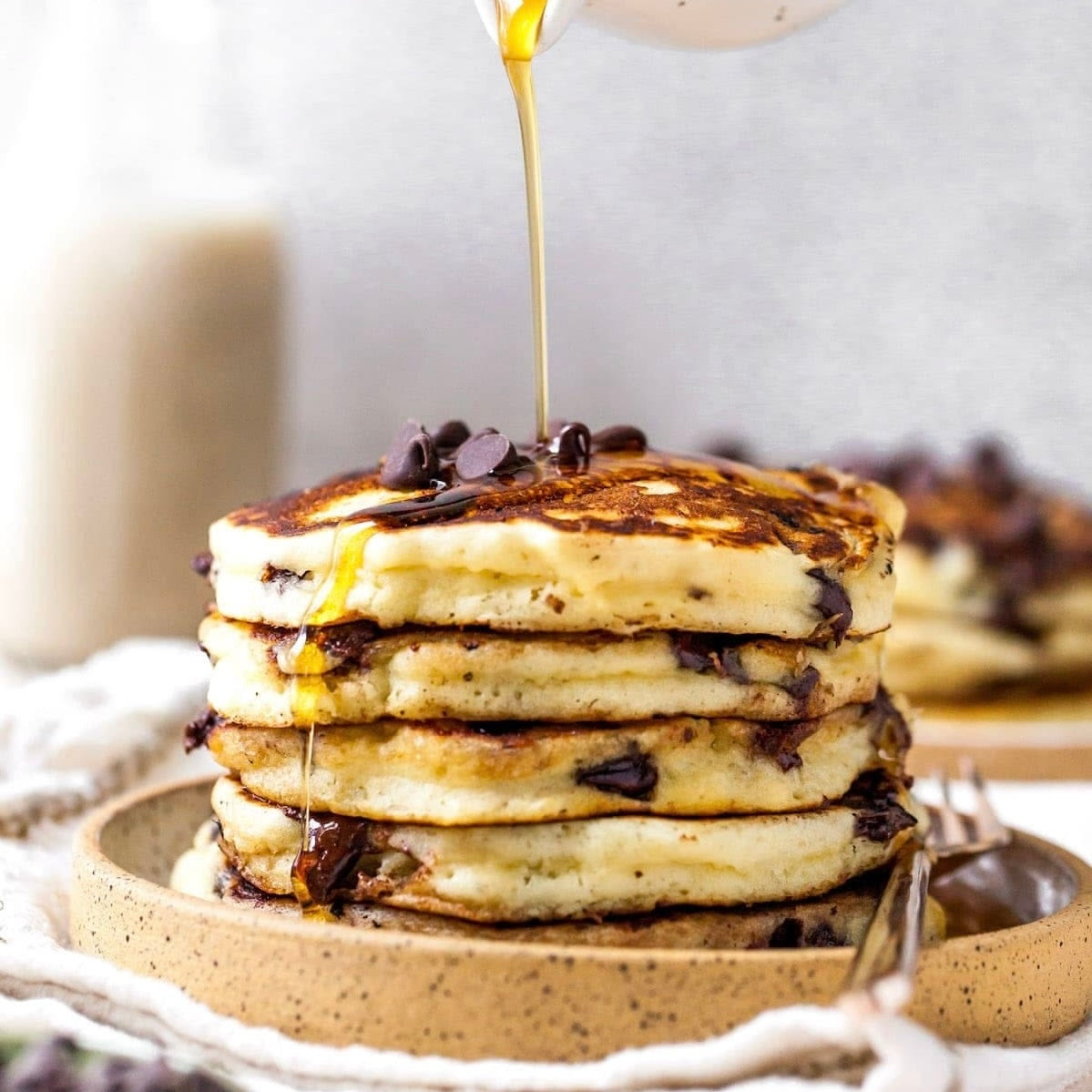 Chocolate Chip Protein Pancakes with Yogurt Turkey Sausage Scrambled Eggs & Syrup